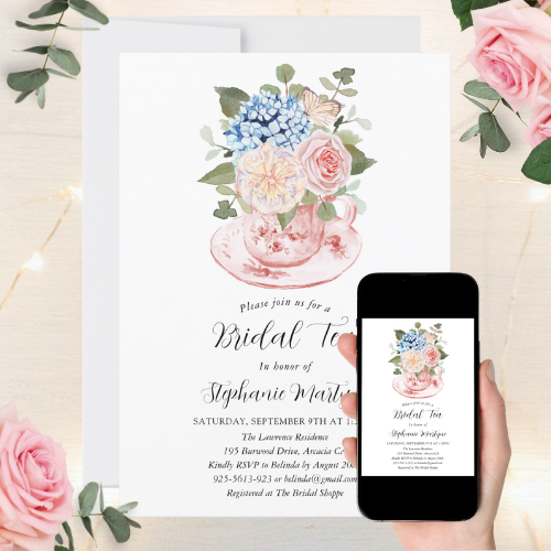 Digital and printable bridal shower invitation with watercolor teacup design with blue hydrangea and pink flowers with butterfly and script typography.